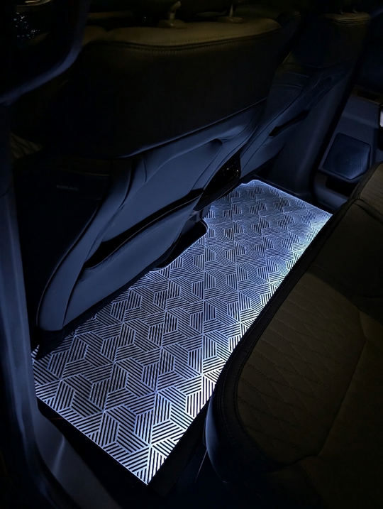 Car interior with a geometric patterned mat on the floor